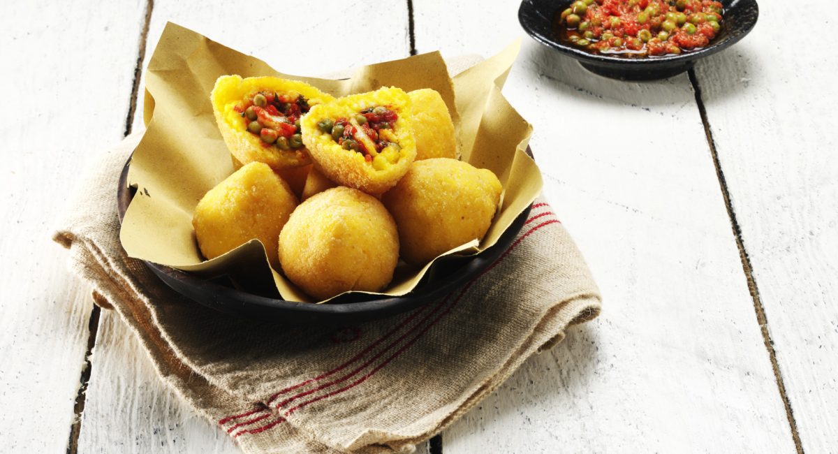 Arancine di riso Baldo con sugo di pomodoro con piselli