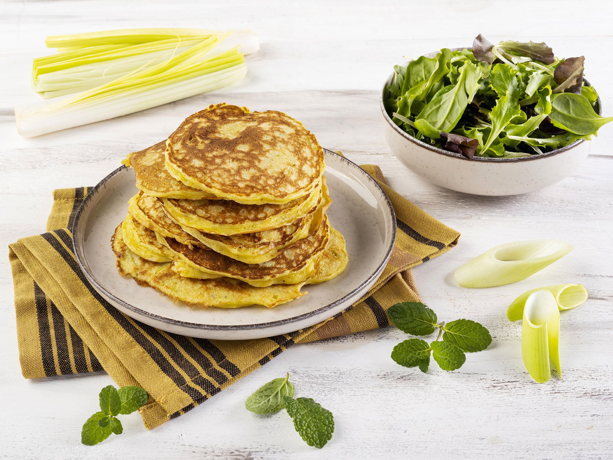Pancake con purea di patate, porri e basilico